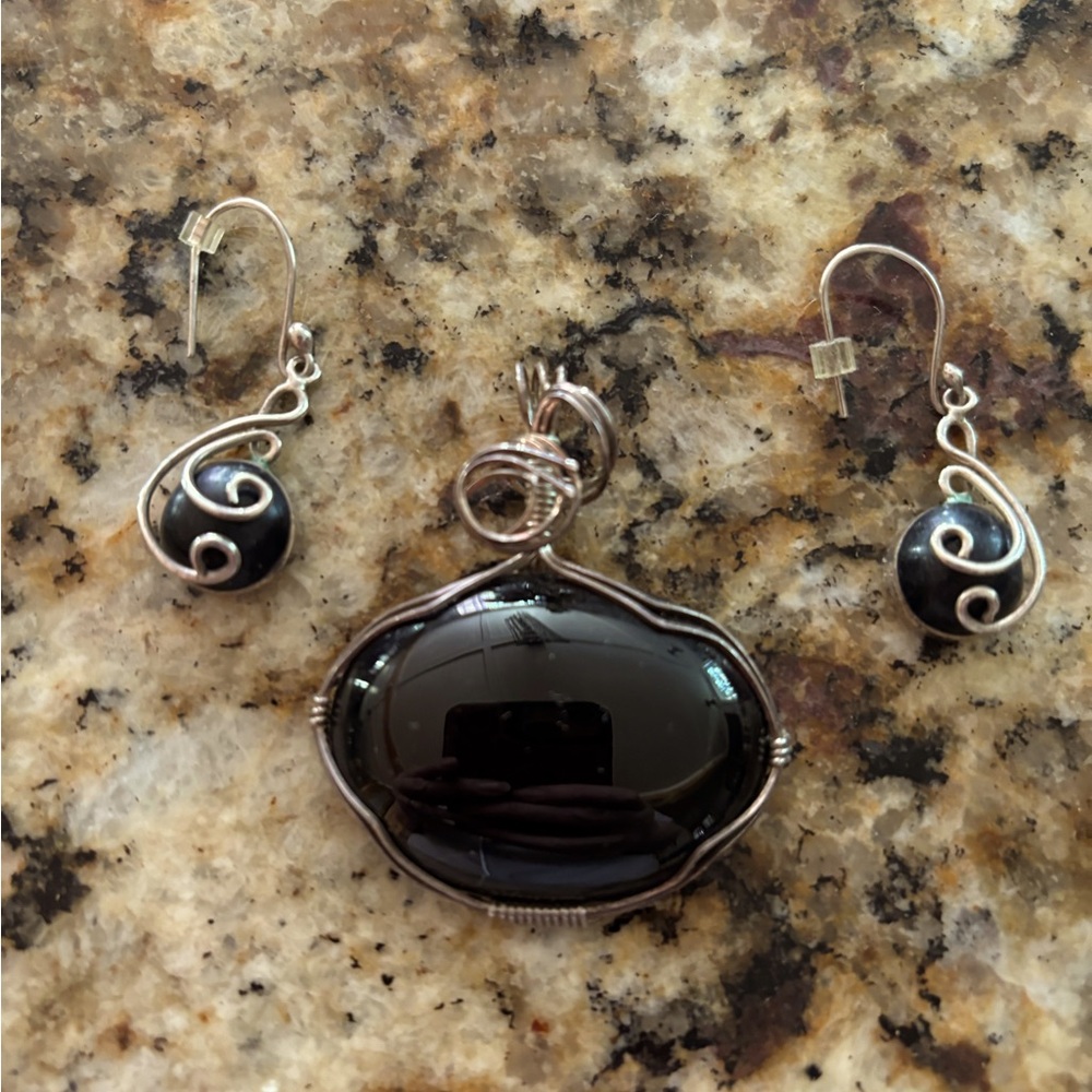 Onyx pendant earrings set in sterling